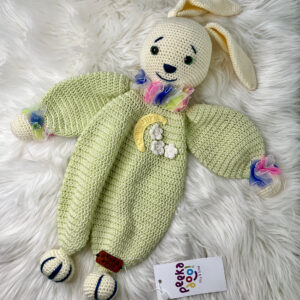 Crochet rabbit sleeping body toy with a soothing music box, crafted from soft cotton and bamboo yarn. Designed to stimulate senses and grab attention, this eco-friendly toy supports child development with its calming melodies and delightful rabbit design.